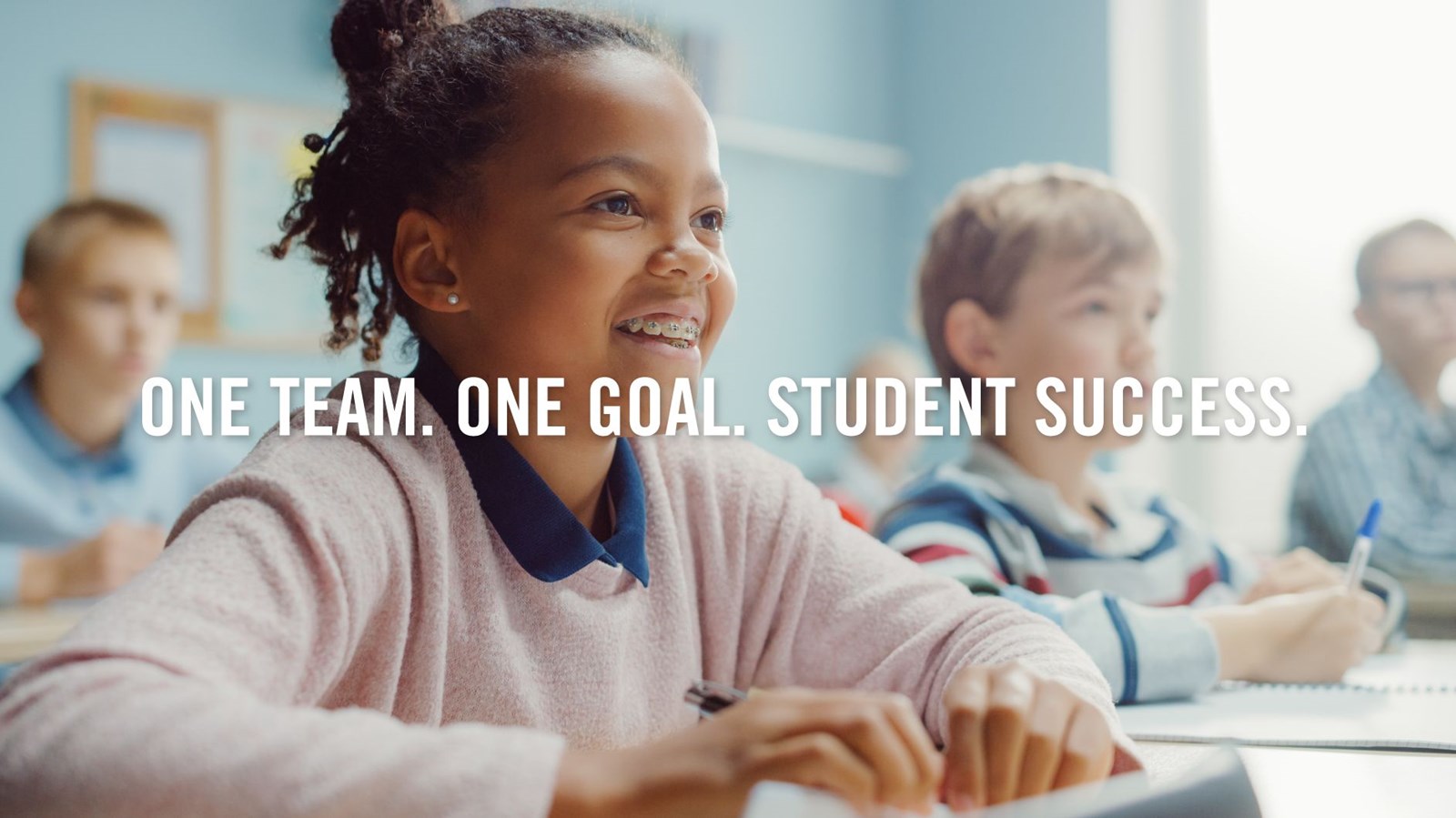One Team One Goal Student Success - Smiling Kids in Classroom